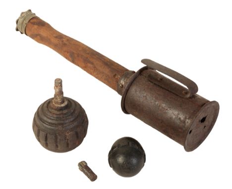 TWO WWI GERMAN EGG BOMBS and a WWI stick grenade, stamped to the wooden grip "SEK.AEG" (3)