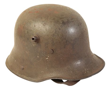 A WWI M16 GERMAN HELMET with leather lining and chin-piece.