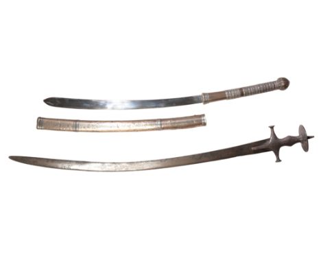 A LATE 19TH CENTURY WHITE METAL MOUNTED TIBETAN SWORD the curved single-edged blade with a white metal banded grip and pommel