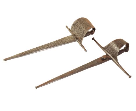 A 17TH CENTURY STYLE SPANISH GAUCHE DAGGER the tapered blade pierced at the forte with a shaped guard with turned-over edges 