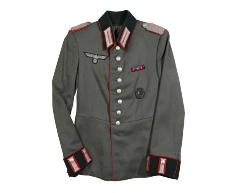 A WWII GERMAN ARTILLERY OFFICERS WAFFENROCK a small sized tunic, probably around a 36 to 38 inch chest. Lieutenant in rank, t