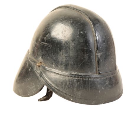 A WWI BRITISH LEATHER FIRE HELMET with original leather lining and leather chin strap, size 6 7/8, with initials painted insi