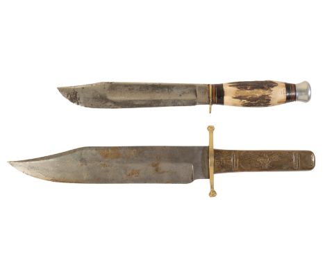 TWO BOWIE KNIVES the first a large example with brass handle showing an American Eagle ' Liberty and Unity. The blade is stam
