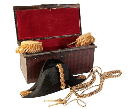 A ROYAL NAVAL OFFICERS BICORN HAT AND EPAULETTES by Gieves Ltd, 21 Old Bond Street, London, in the original fitted military s