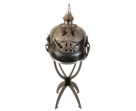 A WWI IMPERIAL GERMAN PICKELHAUBE the leather skull with original lining and leather chin strap,  spike top, pressed metal he