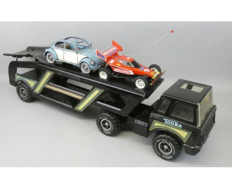 A Tonka car transporter in black livery with gold sticker decal, MR-970, together with a boxed radio control Aero Mini Hopper