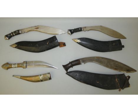 An Arabian Jambiya with brass handle and scabbard, mounted with white metal decoration, 20cm blade, 35cm overall. Together wi