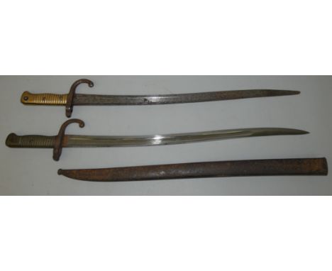 Two French Chassepot bayonets, one missing the scabbard, one marked 1874.