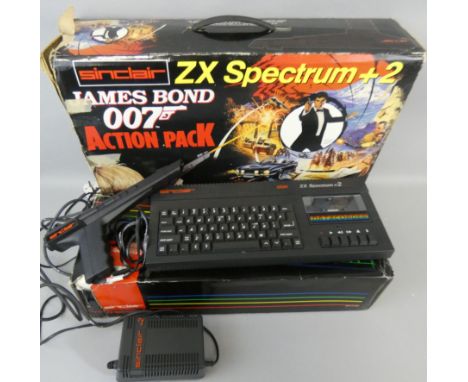 A boxed Sinclair ZX Spectrum +2 'James Bond 007 Action Pack' computer, with light gun, power supply, computer instruction man