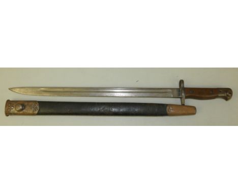 A 1907 pattern Lee Enfield bayonet by Wilkinson, 43cm blade in a blackened leather steel tipped scabbard, overall length 58cm
