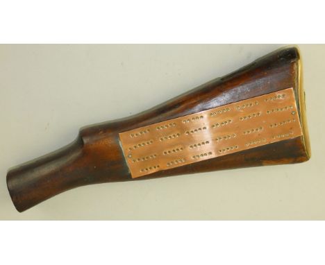 The sawn-off butt of a Lee Enfield Rifle with butt plate, and mounted with a copper cribbage board, length 33cm.