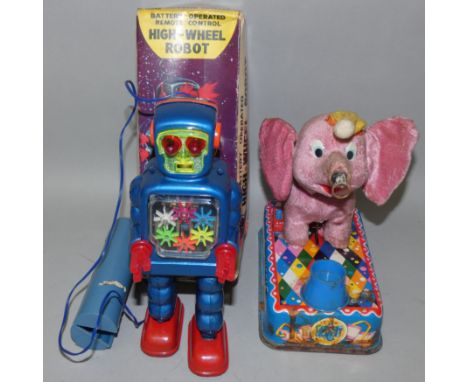 A boxed battery-operated remote control high-wheel robot No. 5023, with lighted eyes and bpody, ttelescopic aerial and walkin