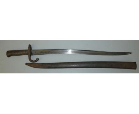 A French Chassepot bayonet, the serpentine fullered blade 57.5cm long marked, Novembre 1867, with brass hilt and curved quill