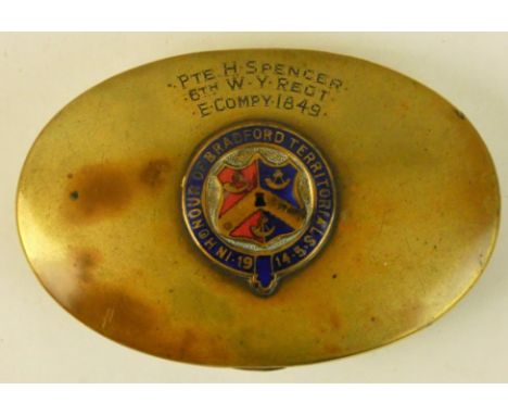 A brass snuff box engraved to Pte. H. Spencer, 6th W.Y Regt. E. compy. 1849 and mounted with an enamelled badge bearing the l