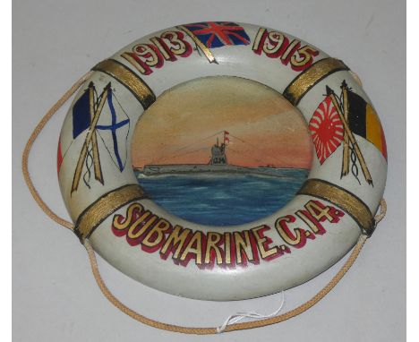 A WWI Souvenir in the form of a 21cm diameter life belt hand painted with flags, the dates 1913-1915 and the title Submarine 