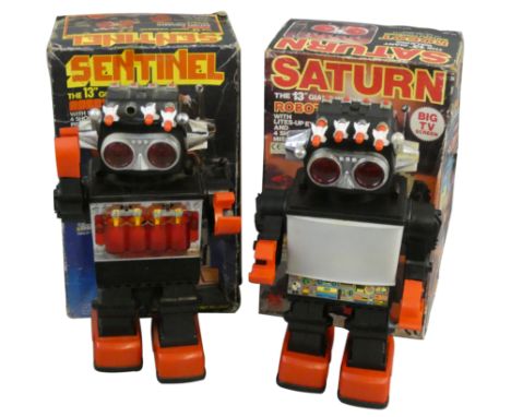 A Kamco battery operated 13" giant walking robot 'Saturn', with lites-up eyes and 4 shooting missiles, No. 1981, together wit