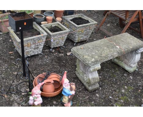 A WEATHERED COMPOSITE GARDEN BENCH, on twin scrolled supports, length 94cm, along with a terracotta graduated water feature b