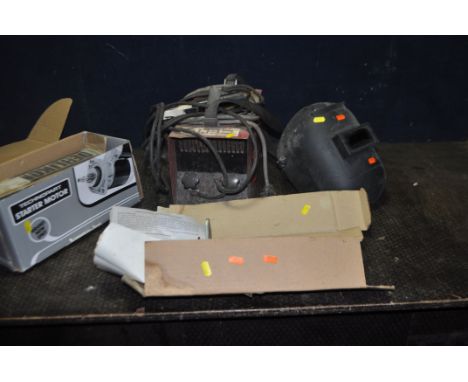 A VINTAGE ELTO SUPER 60 ELECTRIC ARC WELDING PLANT with electrode clamp and earth clamp, a helmet, a box of welding rods and 