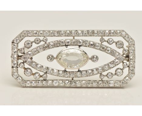AN ART DECO WHITE METAL, DIAMOND SET BROOCH, of a rectangular form, set with a central oval cut diamond, estimated diamond we