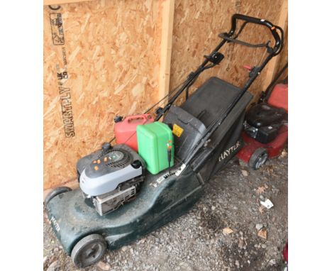 A HAYTER HARRIER 48 AUTODRIVE E/S SELF PROPELLED PETROL LAWNMOWER, with a grass box and two petrol cans, condition report: en