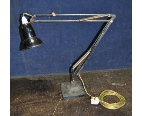 GEORGE CARWARDINE FOR ANGLE POISE A MID 20th CENTURY ARTICULATED DESK LAMP model 1208 with a flared and shaped cast iron base