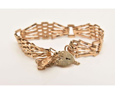 A 9CT GOLD GATE BRACELET, AF five bar bracelet fitted with a heart padlock clasp, with additional safety chain, hallmarked 9c