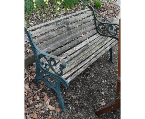 A CAST IRON GARDEN BENCH, with teak slats, length 128cm, condition report: rickety frame, weathered finish