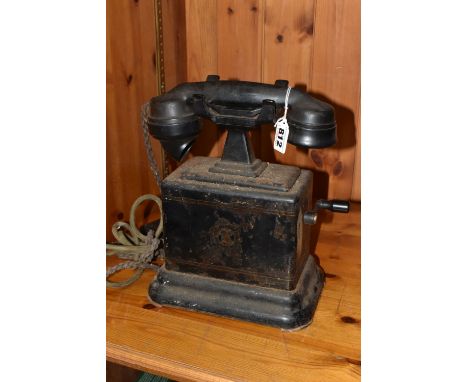 AN EARLY TWENTIETH CENTURY ERICSSON DESK TELEPHONE, with side crank and Bakelite receiver, worn partial decal to front, heigh