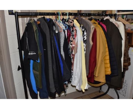 A LARGE QUANTITY OF LADIES AND GENTLEMENS CLOTHING, ladies to include blouses, jackets, overcoats, two vintage fur coats (sig