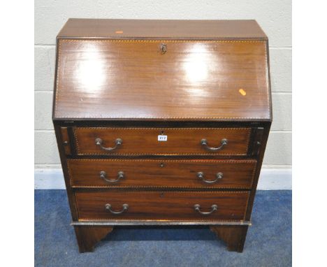 AN EARLY 20TH CENTURY MAHOGANY AND CROSS BANDED BUREAU, the fall front door enclosing a fitted interior, over three drawers, 