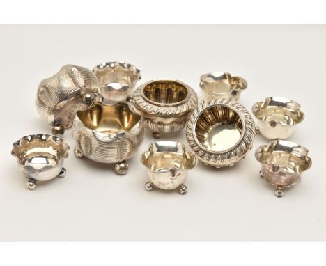 A BAG OF ASSORTED SILVER SALTS, to include four small wavy beaded rim salts, each on three ball feet, hallmarked 'Gibson &amp
