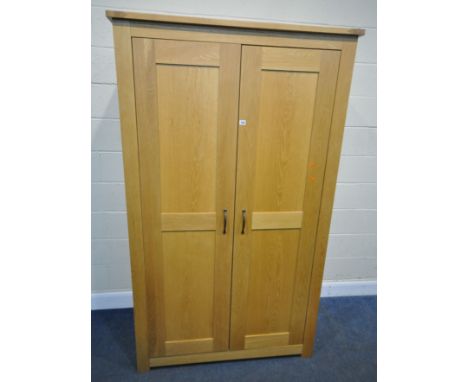 A MODERN OAK DOUBLE DOOR WARDROBE, width 120cm x depth 62cm x height 201cm condition report: marks, scuffs, other signs of us