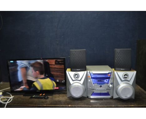 A BUSH 32in TV WITH REMOTE and a Thomson Hi Fi (one tape not playing) with remote, a pair of matching speakers and a pair of 