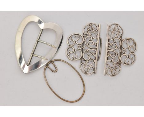 THREE SILVER BELT BUCKLES, the first a nurses scrolling open work belt buckle, hallmarked 'Thomas Hayes' (possibly, rubbed ma