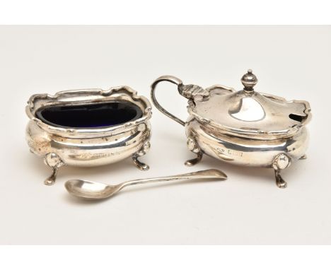 A SILVER SALT AND MUSTARD WITH SALT SPOON, the salt and mustard of an oval form with wavy rim, raised on four cabriole legs, 