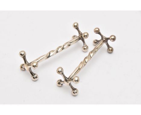 A PAIR OF EARLY 20TH CENTURY SILVER KNIFE RESTS, twist detail with beaded terminals, hallmarked 'Cooper Brothers &amp; Sons L