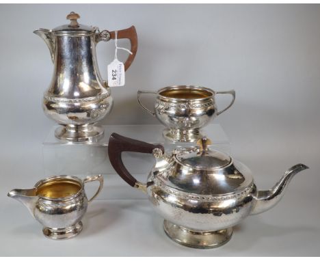 George V silver four piece beaten finish tea service, by Albert Edward Jones of Birmingham, various dates from the 1920s. 32 