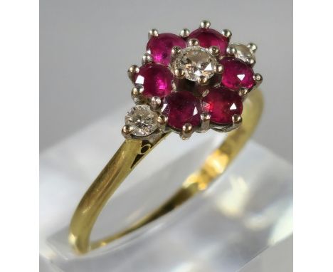 Gold, diamond and ruby flowerhead cluster ring. Rubbed hallmarks. 3.9g approx. Size R. (B.P. 21% + VAT) 