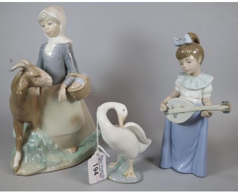 Two Lladro Spanish porcelain figure groups, one of a young girl with goat together with a Nao porcelain figure of a girl with