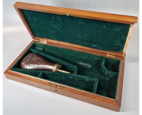 Modern hardwood fitted pistol box together with a repousse copper powder flask.  (2)  (B.P. 21% + VAT) 
