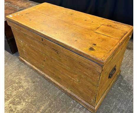 19th century pine trunk with iron carrying handles. 110cm wide x 55cm deep x 60cm high approx. (B.P. 21% + VAT) 