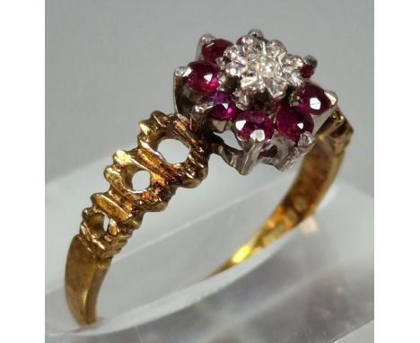 18ct gold diamond and ruby flower head ring. 3g approx. Size N. (B.P. 21% + VAT) 