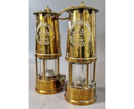 Two brass Miner's lamps, both marked 'The Protector Lamp and Lighting Co. Eccles'. (2) (B.P. 21% + VAT) 