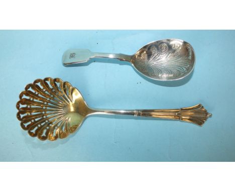 A Victorian silver sifter spoon of shell form with gilt bowl, Sheffield 1889 and a silver caddy spoon, London 1841, (2).