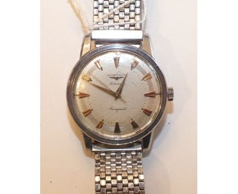 Longines, a gentleman's "Conquest" steel cased automatic wrist watch c1960, the silvered dial with gilt facetted batons, the 