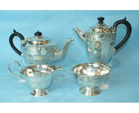 A four-piece silver tea service of pedestal twelve-sided form, Viners Ltd, Sheffield 1933/4, total weight approximately ___37