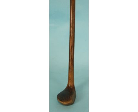 A novelty walking stick in the form of a golf club, the weighted head signed 'Robinson Halle', 89cm long.