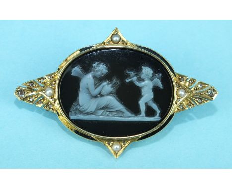 A Victorian brooch set an oval hard stone cameo depicting a classical scene of winged goddess and cupid, within an unmarked b