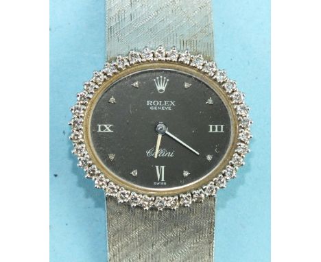 Rolex, a ladies 18ct white gold diamond-set Rolex Cellini wrist watch c1970's, the oval black dial with diamond and Roman num