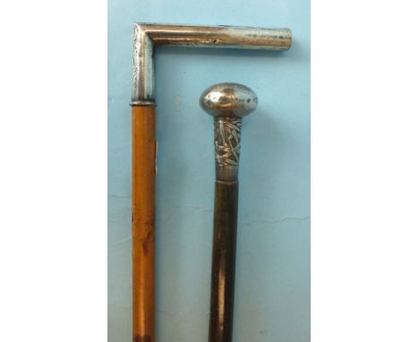 A horn walking cane with Chinese silver knop and bamboo-decorated mount, 63.5cm, (a/f) and a Chinese silver-handled walking s